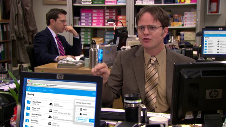 Dwight arguing with a coworker. Sync is shown on their computer.